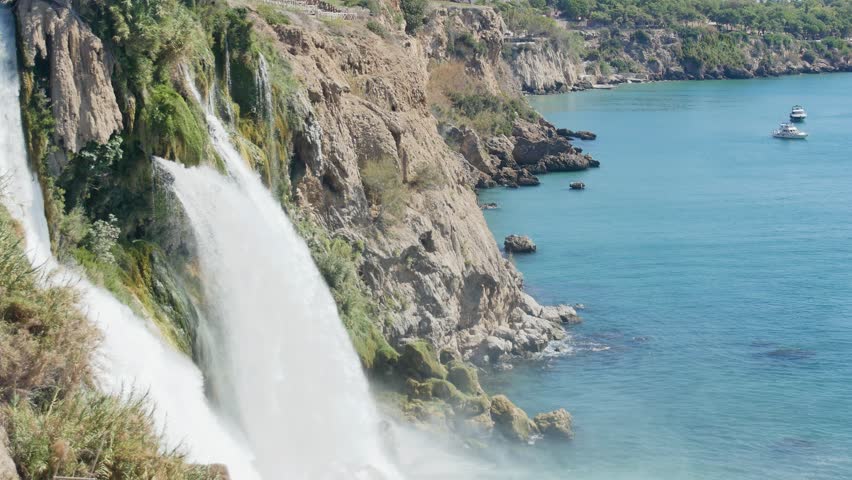Cinematic footage showcasing the grandeur of the powerful Düden Selalesi—often cited as the largest waterfall flowing directly into the Mediterranean.