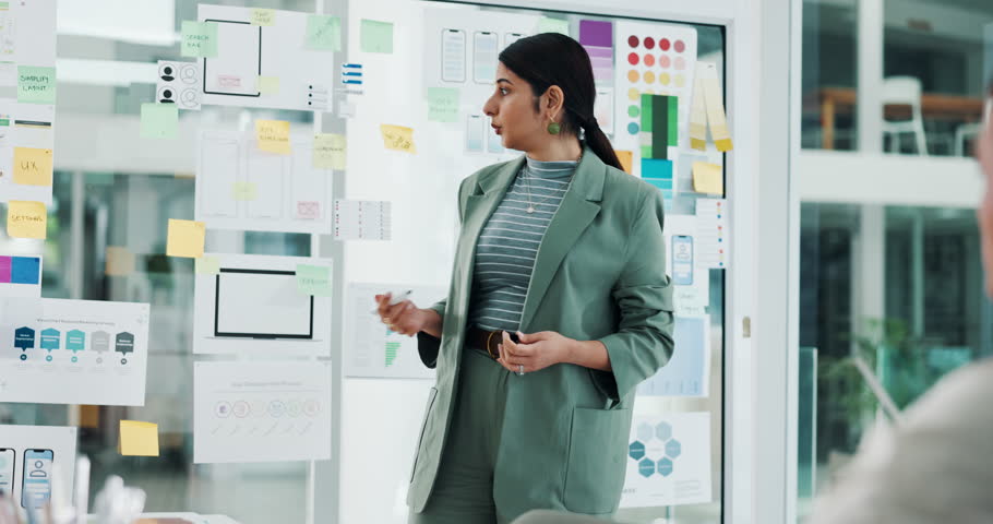 Business, woman and presentation with glass in office for ux design, ui layout and interface planning. Speaker, explain and notes with wireframe for user experience, template and ideas for software