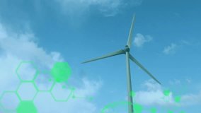 Green hexagonal overlay fading in over wind turbine before blades rotating for real time monitoring. Renewable, sustainability, digital, innovation, technology, architecture, environment - Powered by Shutterstock - Get 15% off with code: PIKWIZARD15