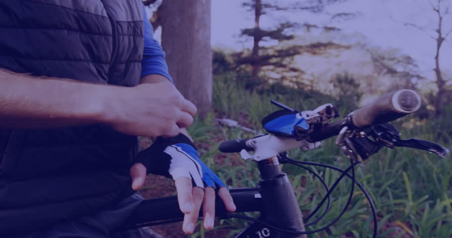 Cyclist walking to bike triggers animated data charts while pulling cycling gloves for fitness ride. Adventure, outdoor, activity, nature, technology, fitness, performance