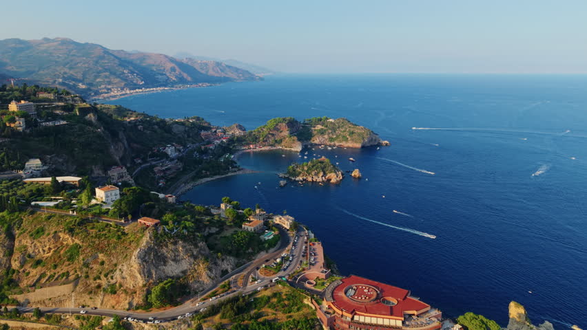 Aerial view of Taormina coastline, serene ocean, Sicily, Italy cityscape