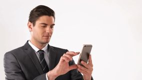 businessman tapping gold smartphone in white backdrop, visualizing neon data cloud orbiting head. Technology, innovation, digital, futuristic, communication, networking, modern - Powered by Shutterstock - Get 15% off with code: PIKWIZARD15