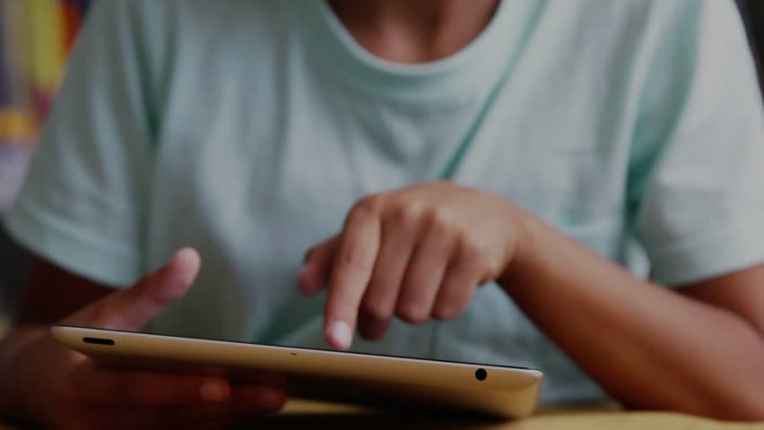 Child boy tapping tablet in home library and witnessing animated like-count rising for engagement. Pollution, digital, learning, growth, technology, education, kids - Powered by Shutterstock - Get 15% off with code: PIKWIZARD15