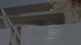 Glitch receding revealing woman scrolling tablet, analyzing business data and confirming insights. Futuristic, technology, focus, concentration, modern, workspace, digital - Powered by Shutterstock - Get 15% off with code: PIKWIZARD15