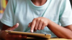 Boy tapping tablet screen initiating swirling 3D digits around hands for interactive math learning. Children, technology, education, digital, animation, innovation, creativity - Powered by Shutterstock - Get 15% off with code: PIKWIZARD15