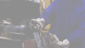 Welder opening blowtorch valve igniting flame on tube, globe rotating and depicting manufacturing. Industrial, craftsmanship, innovation, engineering, precision, construction, technology - Powered by Shutterstock - Get 15% off with code: PIKWIZARD15