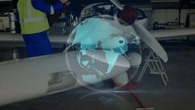 Aviation tech using torque wrench activating hologram on propeller tightening bolts for smooth spin. Aerospace, engineering, maintenance, innovation, technology, visualization, industry - Powered by Shutterstock - Get 15% off with code: PIKWIZARD15