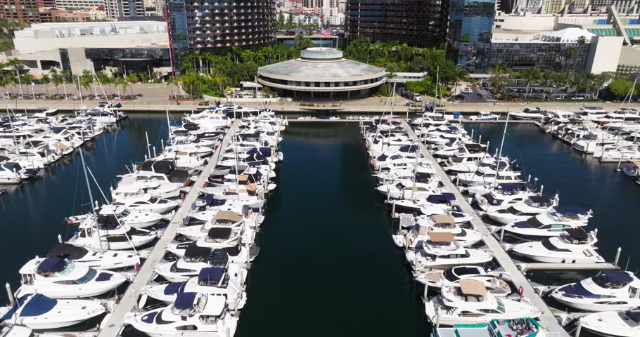 Downtown Skyline And Marina Filled With Boats In San Diego Bay, California, United States. Aerial Pullback Shot