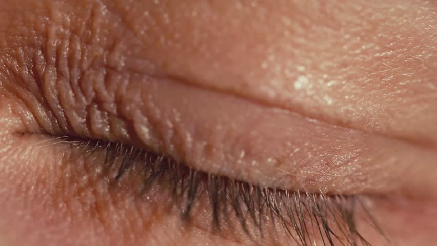 Close-up of a portal passing through an eye. 4K