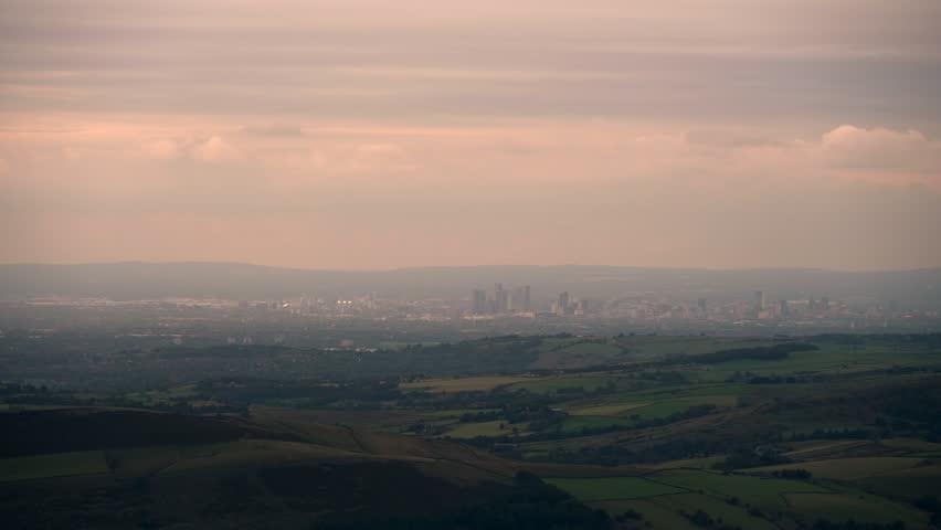 Amazing sunrise view of Manchester city centre skyline and greater Manchester area