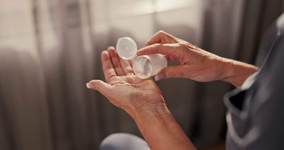 Hands, senior woman and bottle of pills for medicine, prescription supplements and health treatment. Drugs, medication and elderly person with pharmaceutical product, cure or medical wellness in home