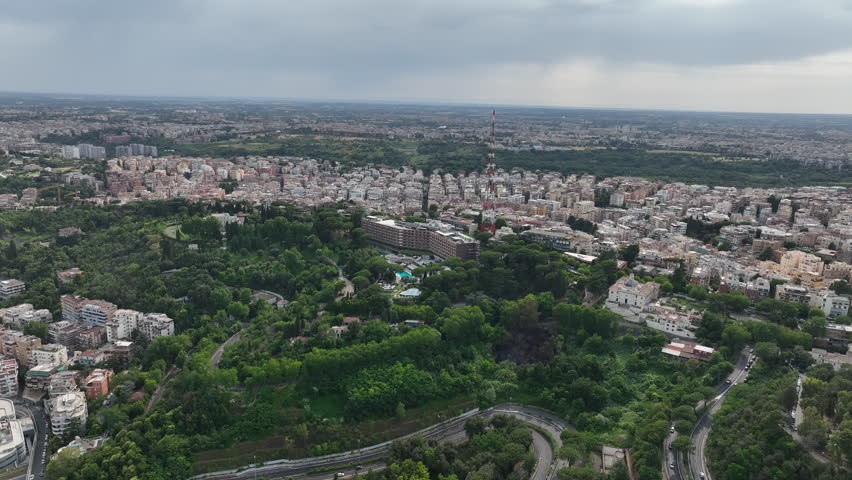 Cityscape with Modern Hotel, Gardens and Communication Tower in Rome