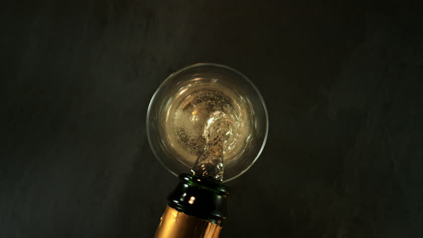 Super Slow Motion Shot of Pouring Champagne with Camera Motion Into Liquid at 1000fps.