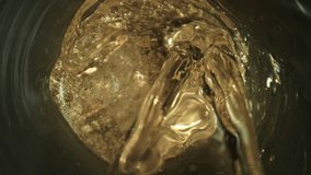 Super Slow Motion Shot of Pouring Champagne with Camera Motion Into Liquid at 1000fps. - Powered by Shutterstock - Get 15% off with code: PIKWIZARD15