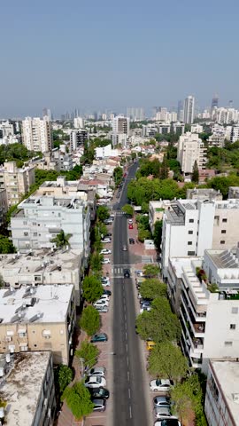 Vertical 4K Drone Shot of Moshe Dayan Street in Ramat Gan with Tel Aviv Skyline in Background, Israel