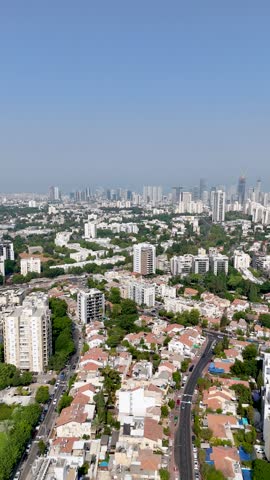 Vertical 4K Drone Shot of Tel Aviv Skyline with Ramat Gan and Giv