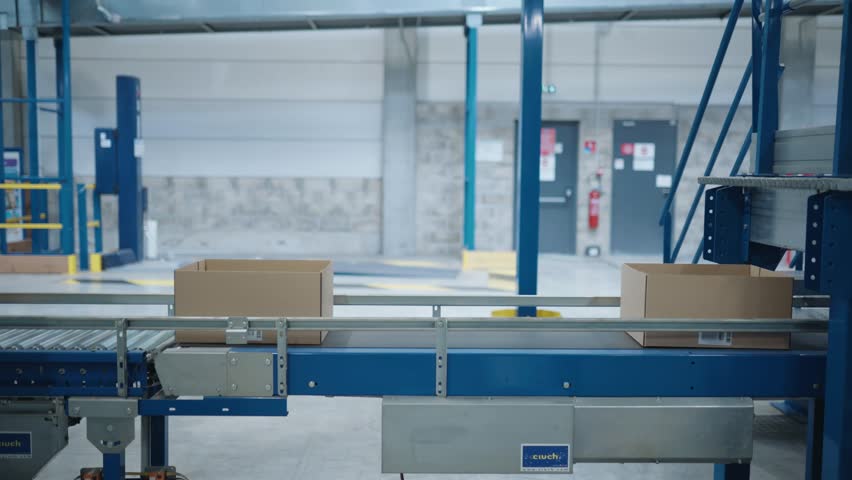 Boxes moving along a conveyor belt in factory in France.