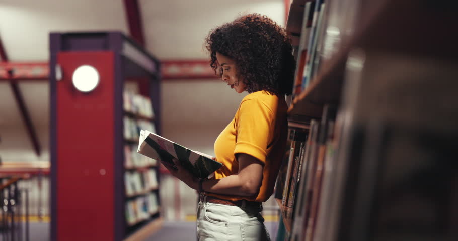 Woman, student and reading with book in library for choice, knowledge or literature in bookstore. Female person, academic or learning with information, insight or novel for study, story or education