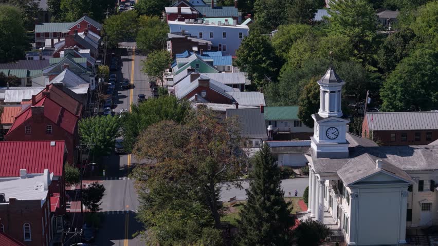 Enjoy stunning aerial views of Shepherdstown, West Virginia, showcasing the vibrant colors of autumn and the charm of this historic small town.