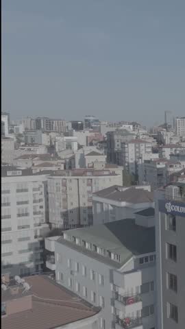 Aerial view of Istanbul streets with Turkish flag, buildings, mountains and daily life