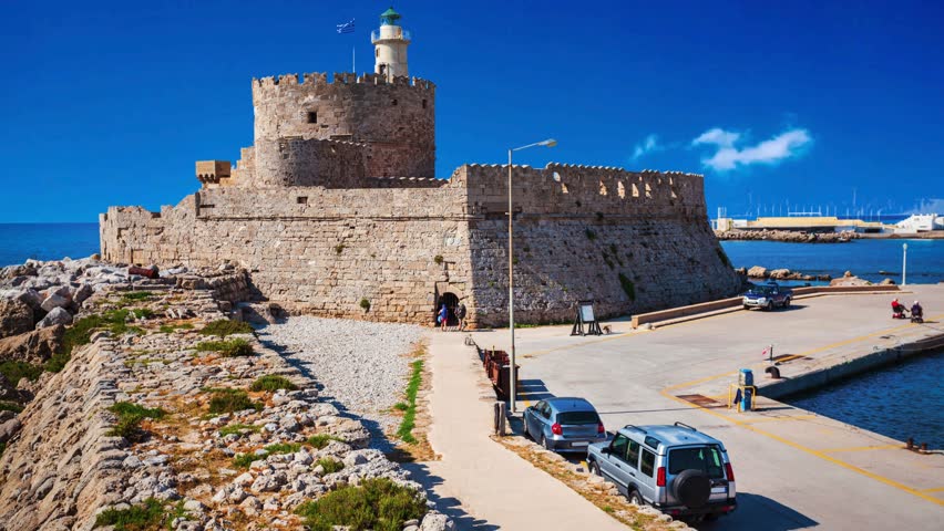 Saint Nicholas Fort guards the Mandraki harbour in Rhodes city, capital of Rhodes island in GreecemSaint Nicholas Fort guards the Mandraki harbour in Rhodes city, capital of Rhodes island in Greece