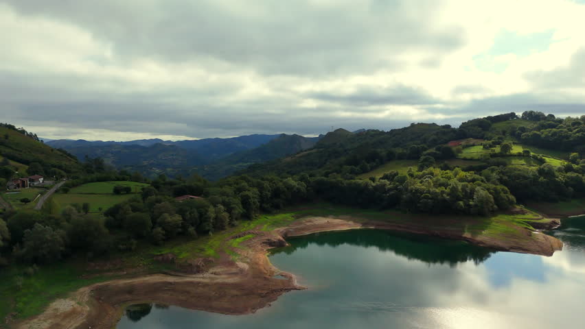 View of mountain valley hills and reflective lake