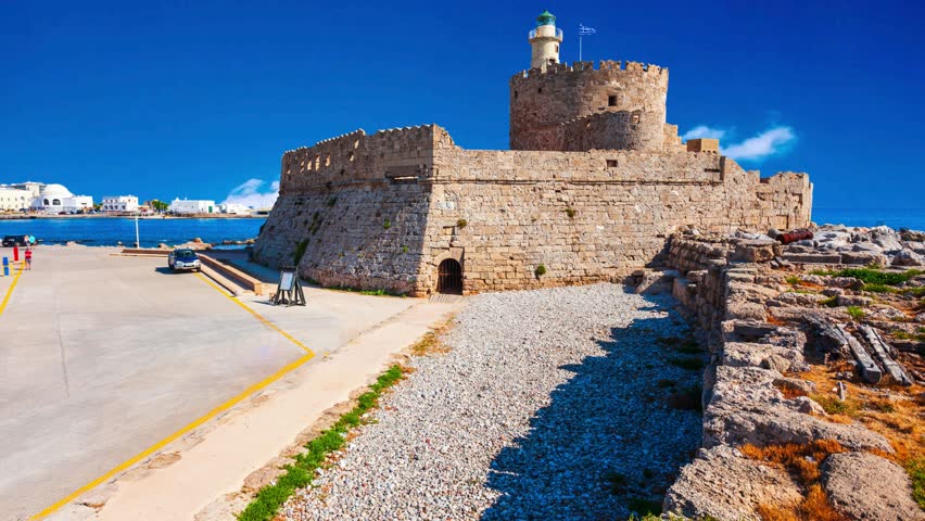 Saint Nicholas Fort at the Mandraki harbour in Rhodes city, capital of Rhodes island in Greece   Rhodes island - Greece, April 6, 2025, Saint Nicholas Fort guards the Mandraki harbour in Rhodes city, 
