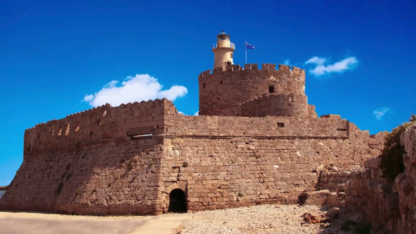 Saint Nicholas Fort guards the Mandraki harbour in Rhodes city, capital of Rhodes island in Greece Saint Nicholas Fort guards the Mandraki harbour in Rhodes city, capital of Rhodes island in Greece