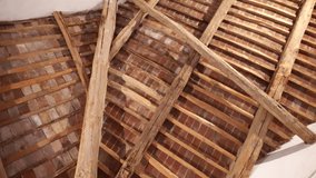 Rotating low angle view of antique ceiling made of wooden planks and red bricks, construction material of ancient times, vintage design of rooftop. High quality 4k footage - Powered by Shutterstock - Get 15% off with code: PIKWIZARD15