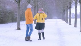 happy older couple strolls along wintery park path, woman and man enjoys peaceful winter walk, love and joy outdoors, togetherness in snowy park, serene joy season, enduring love - Powered by Shutterstock - Get 15% off with code: PIKWIZARD15