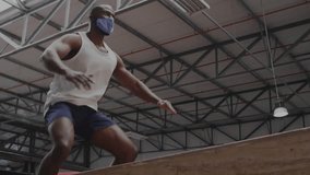 Mid-adult fitness trainee entering gym, squatting on box with overlay swirling strength metrics. Athletic, strength, training, industrial, digital, determination, activewear - Powered by Shutterstock - Get 15% off with code: PIKWIZARD15