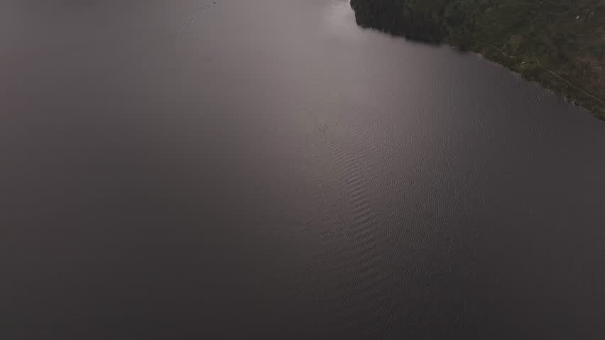 Drone shot revealing the Teton mountain range at sunset in Montana
