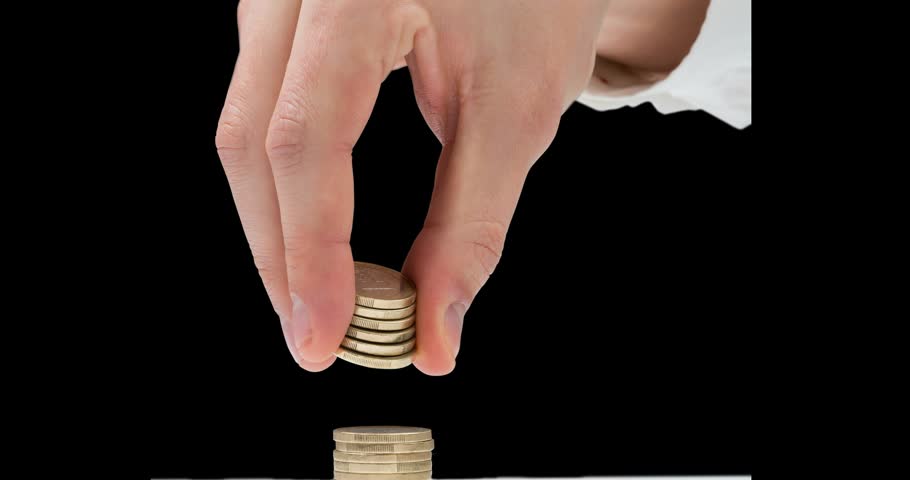 Entering hand stacking coins while world map and UI icons emerging visualizing global finance. Financial, business, technology, data, digital, investment, strategy