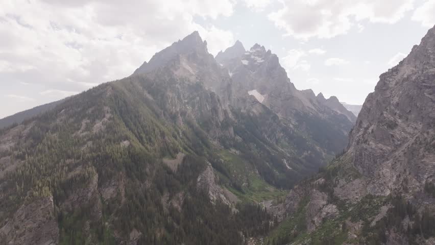 Drone shot of the Teton mountain range at sunset in Montana