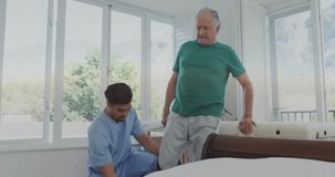 physical therapist kneeling at patient leg adjusting strap animating bar guiding standing support. Rehabilitation, elderly, mobility, recovery, supportive, therapy, healthcare - Powered by Shutterstock - Get 15% off with code: PIKWIZARD15