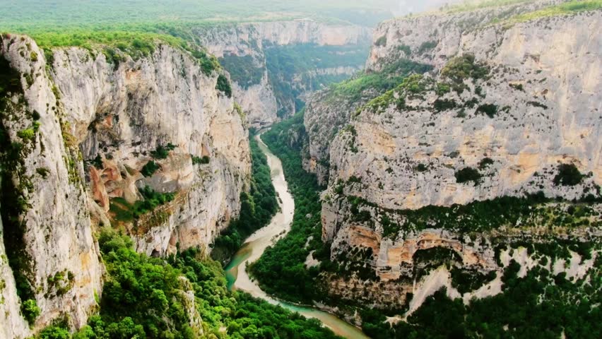 Aerial view of the Verdon Gorge, southeastern France, highlighting turquoise river, dramatic cliffs, and breathtaking natural landscapes for travel, adventure, and scenic stock.