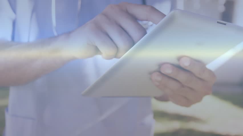 doctor tapping and swiping tablet revealing bars graphs code globe icons visualizing health data. Medical, technology, data, analytics, digital, healthcare, visualization - Powered by Shutterstock - Get 15% off with code: PIKWIZARD15