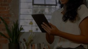 Woman tapping tablet screen and showing animated financial charts with percentages for dashboard. Technology, data, analytics, business, innovation, modern, professional - Powered by Shutterstock - Get 15% off with code: PIKWIZARD15