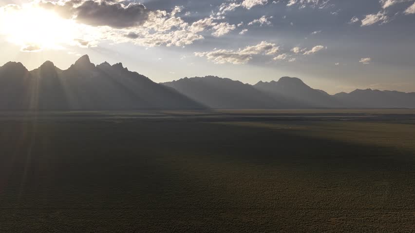 Drone Timelapse of the sun setting over the Teton mountain range