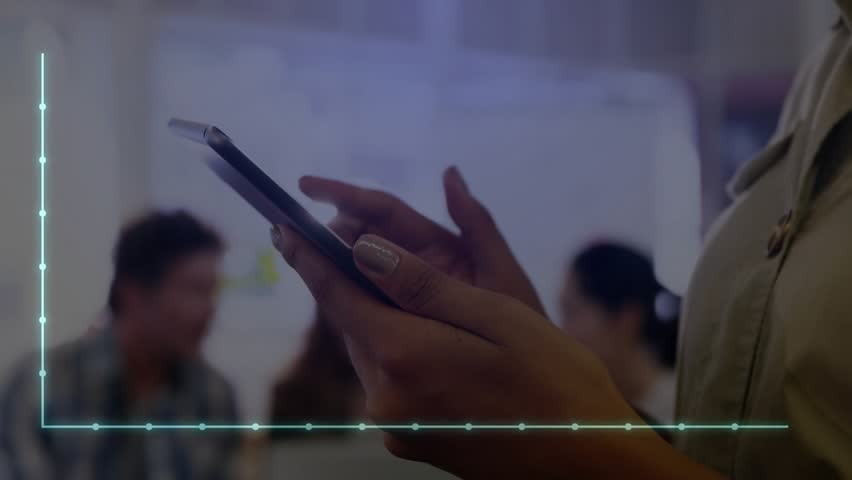 woman tapping tablet in finance hub, activating transparent graph overlay showing downward trend. Collaboration, teamwork, data visualization, business strategy, office environment, digital analysis - Powered by Shutterstock - Get 15% off with code: PIKWIZARD15