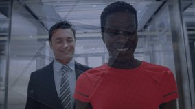 Woman in red top leading colleague in glass atrium and demonstrating holographic tech graphics. Futuristic, collaboration, innovation, digital, corporate, modern, teamwork - Powered by Shutterstock - Get 15% off with code: PIKWIZARD15