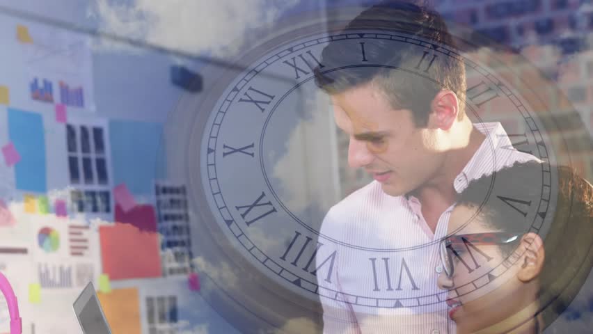 Coworkers opening laptop and starting clock cloud overlays while reviewing design project. Collaboration, design, innovation, workspace, teamwork, creativity, modern