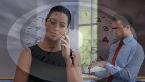 woman speaking on phone, clock overlay appearing signaling business deadline coworker typing laptop. Professional, collaboration, modern, minimalistic, productivity, urgency, workforce - Powered by Shutterstock - Get 15% off with code: PIKWIZARD15