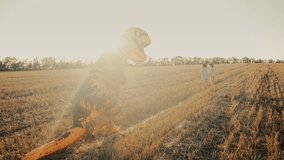 Little kids boys chased by person in inflatable dinosaur T-Rex costume in field - Powered by Shutterstock - Get 15% off with code: PIKWIZARD15