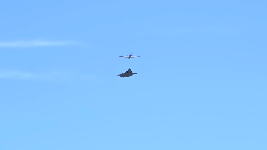 The F-35 fighter jet and the P 51 flew together in an air show.