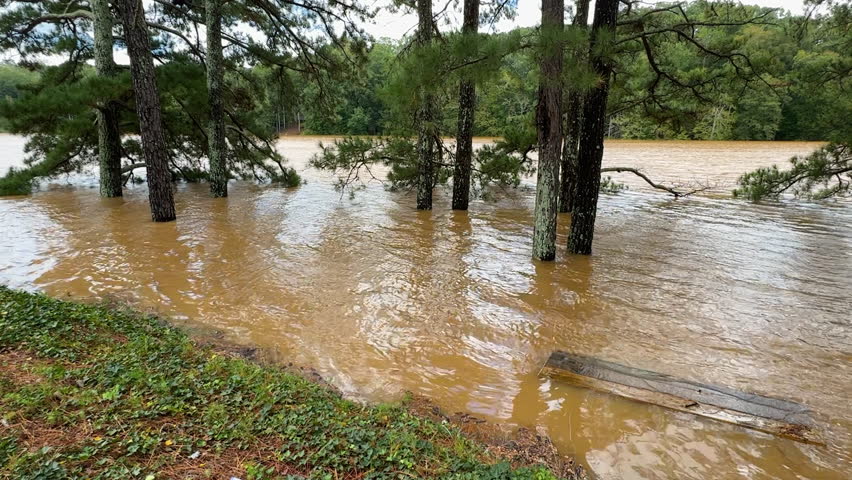 Slow motion shot shows a Georgia lake being swamped by Hurricane Helene floodwaters. 