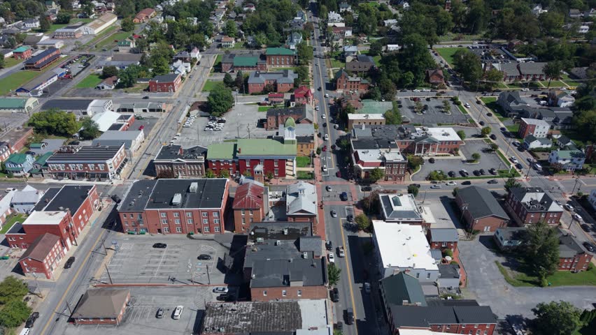 Explore the charming streets of Charles Town, West Virginia, with breathtaking aerial views of the Jefferson County courthouse and vibrant downtown on a clear day.