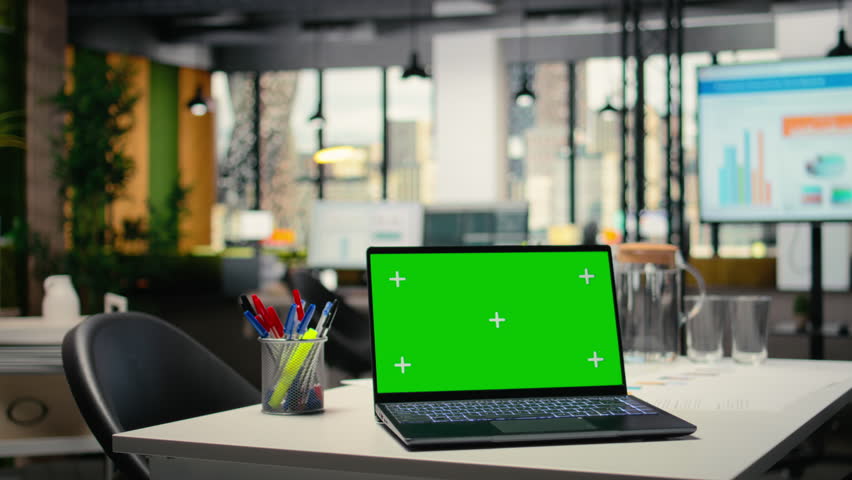 Chroma key display on a modern laptop in empty company workspace, HR department office space prepared for hiring process, interviews and career development plans. PC with mockup.
