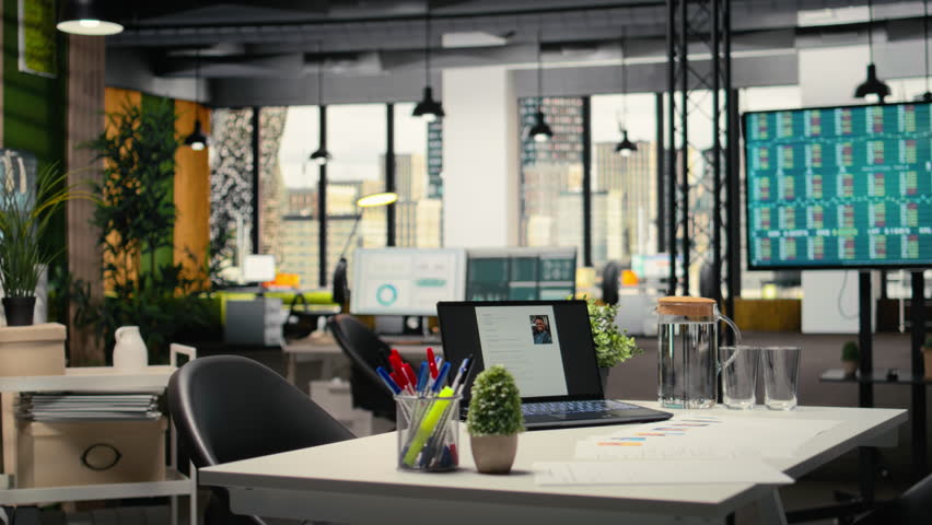 Empty office with a laptop showcasing CV candidate before job interview, space used for the recruitment process and reviewing qualifications or past work experience to align with vacancy.