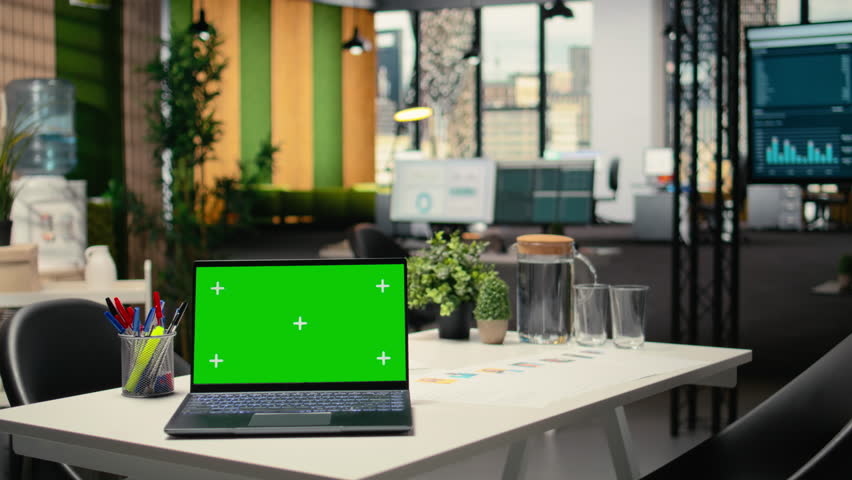 Green screen mockup on laptop in empty corporate workspace, human resources department office and desk prepared for hiring process, interviews and career development. Chroma key.